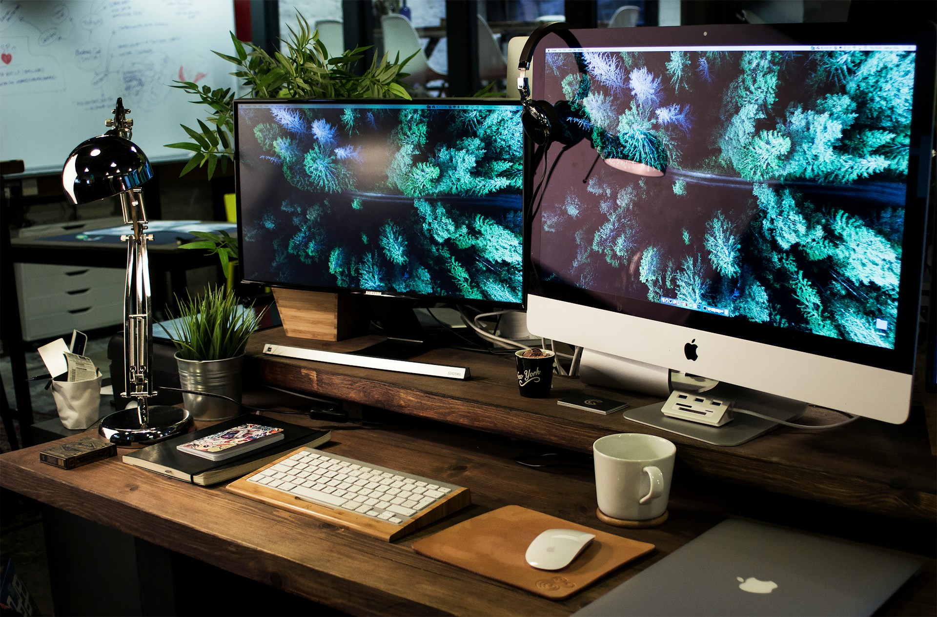 Desk with 3 monitors. Photo by Alex Bachor.